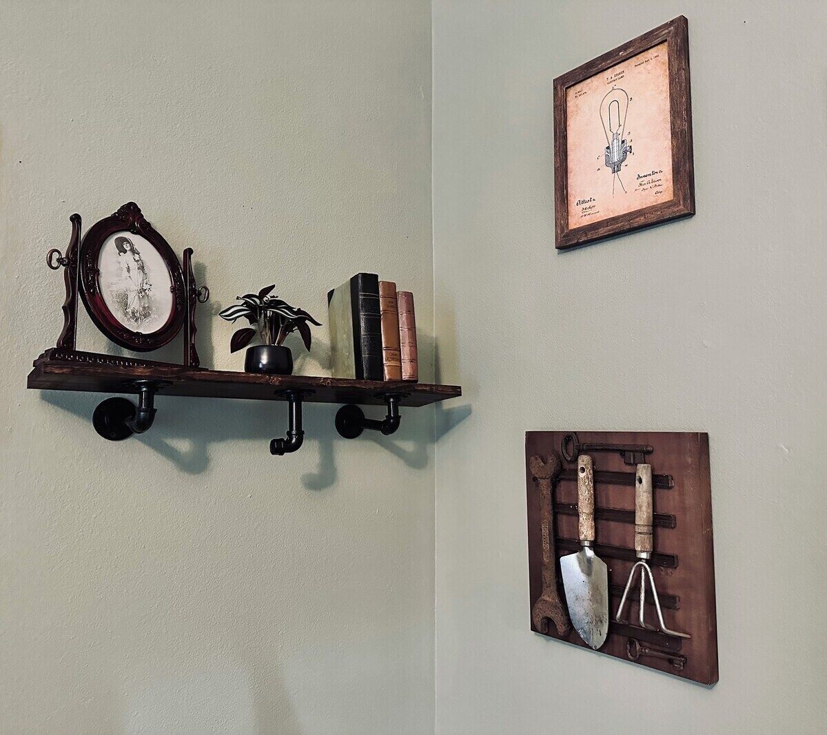 A wall-mounted shelf with a clock, books, and a potted plant.