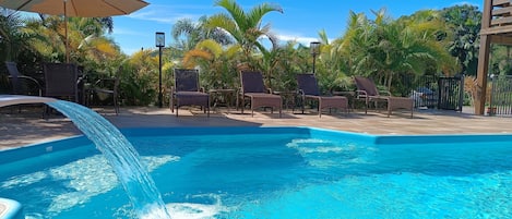 Outdoor pool, open 8:00 AM to 8:00 PM, pool umbrellas, pool loungers