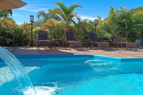 Outdoor pool, open 8:00 AM to 8:00 PM, pool umbrellas, sun loungers