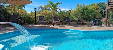 Outdoor pool, open 8:00 AM to 8:00 PM, pool umbrellas, sun loungers