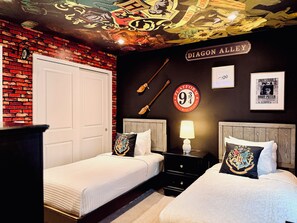 A room with a brick wall, a ceiling mural, a sign reading 'DIAGON ALLEY', and a poster of 'Harry Potter'. - Steps from Clubhouse! 5BR Townhome w/ Private Pool & Themed Rooms (Davenport)