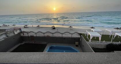 The red villa is the first north coast road, 15 minutes from the airport.