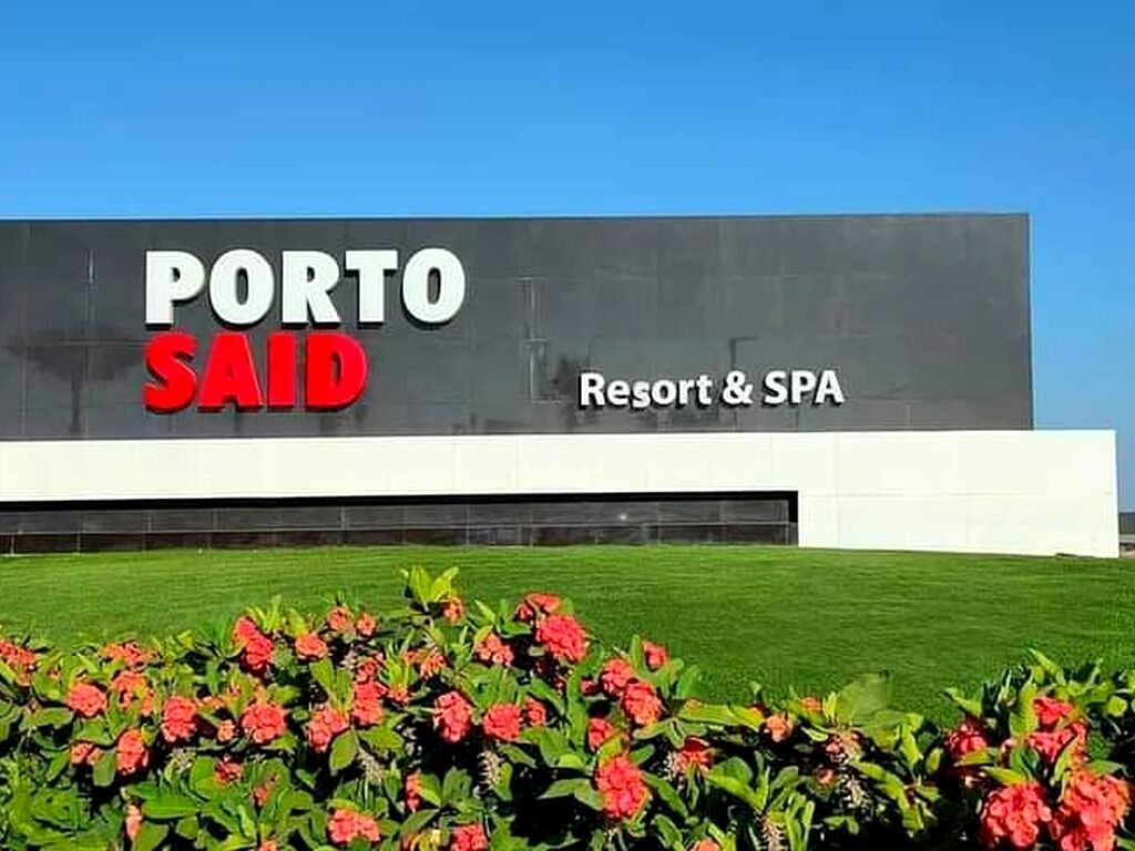 A building with a sign that reads "PORTO SAID Resort & SPA".