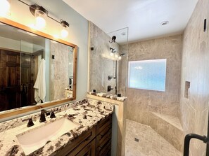 Shower, eco-friendly toiletries, hair dryer, towels