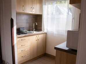 Fridge, microwave, cookware/dishes/utensils