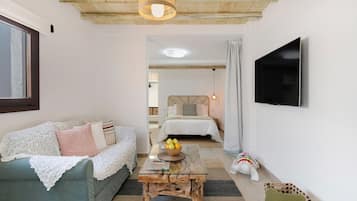 Tabla de planchar con plancha, wifi gratis y ropa de cama