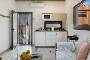 Fridge, microwave, stovetop, coffee/tea maker