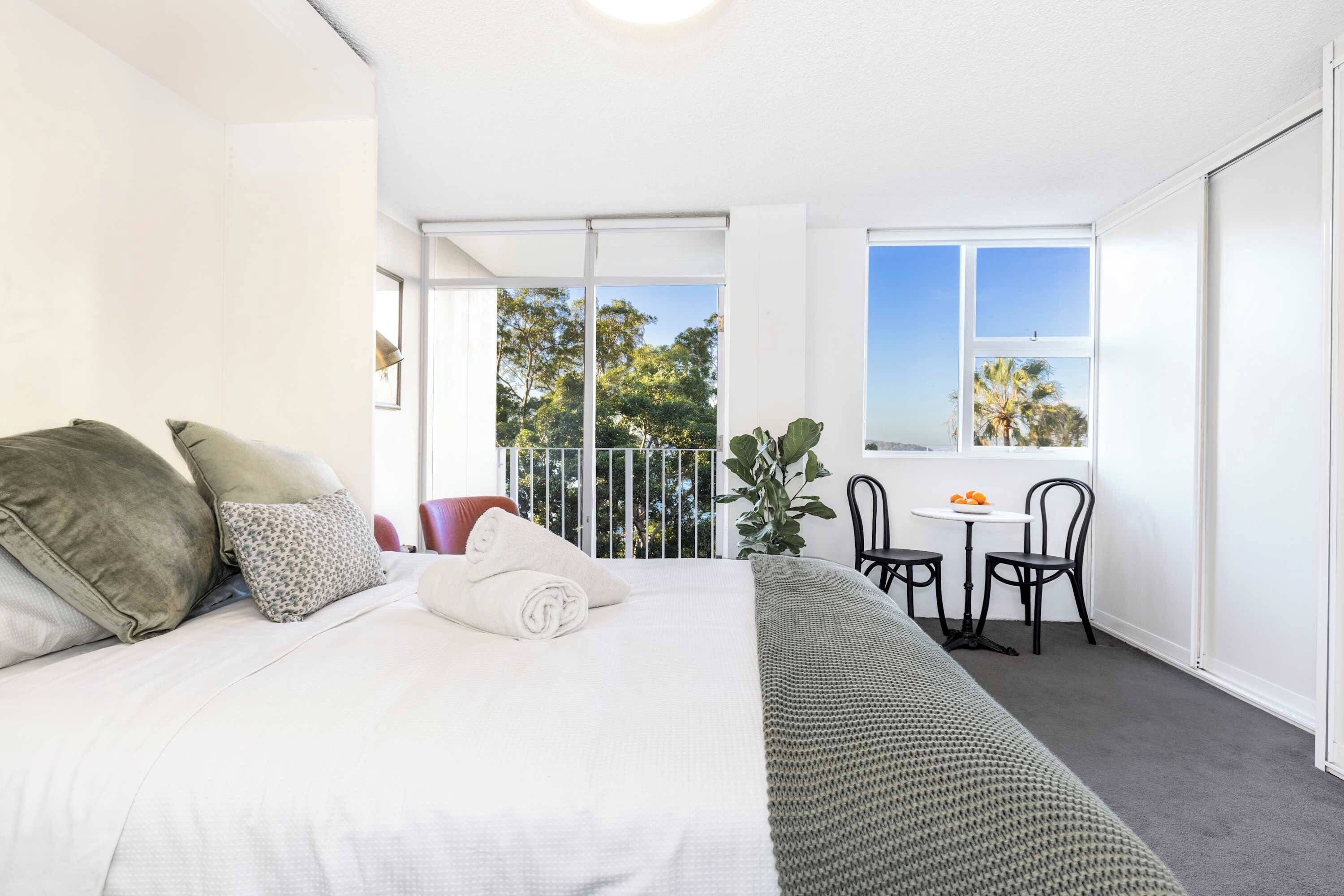 Open plan light filled studio apartment w blockout blinds