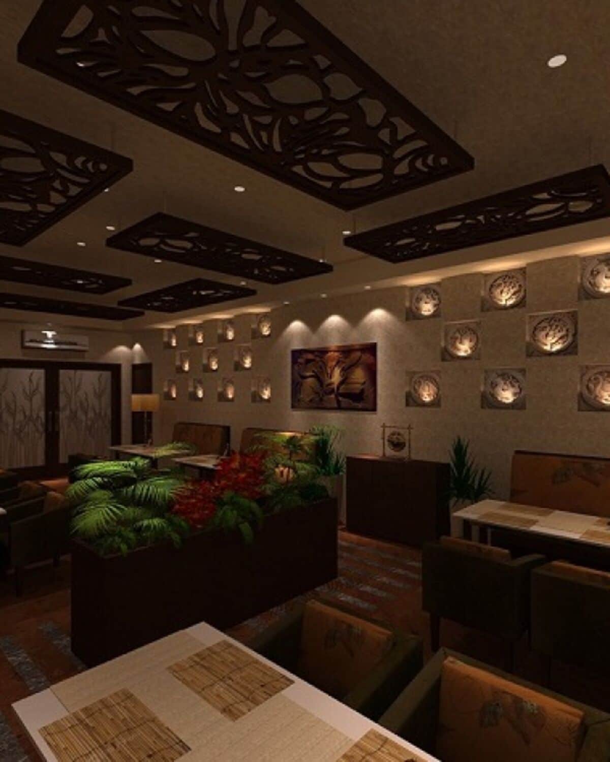 A modern interior with a central seating area, decorative ceiling panels, and wall-mounted lighting.