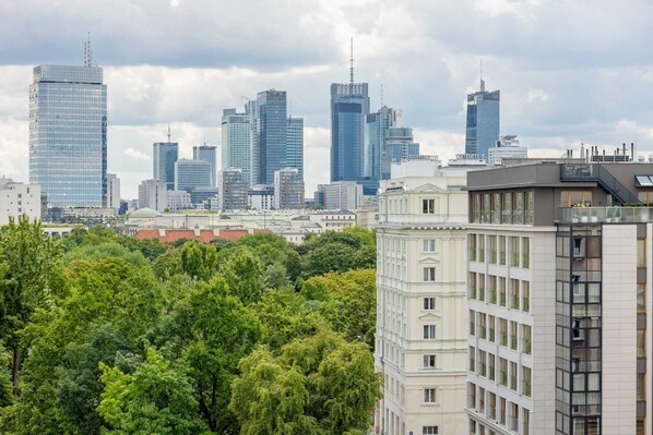 A cityscape with modern skyscrapers and a mix of residential buildings.