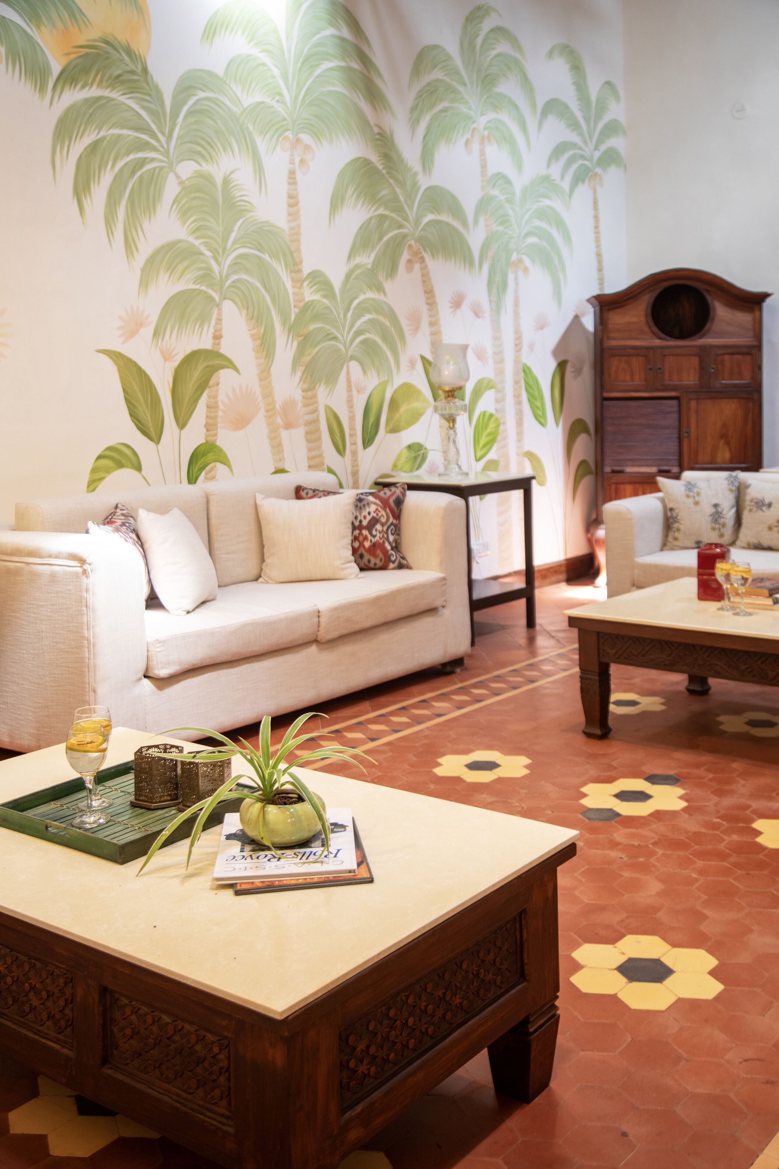 A living room with a sofa, coffee table, and a cabinet.