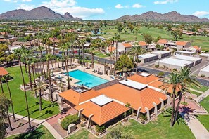 A resort with a swimming pool, palm trees, and a mountainous backdrop. - McCormick Ranch Panorama Golf Vista (Scottsdale)