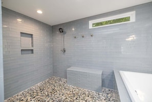 Bathtub, towels, soap, shampoo