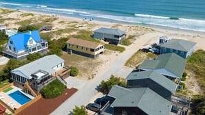 A coastal residential area with houses, a beach, and a swimming pool. - Pleasant Seaprise: Private Pool, 200ft. to Beach (Nags Head)