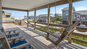 A wooden deck with a swing chair and a pool table. - Pleasant Seaprise: Private Pool, 200ft. to Beach (Nags Head)