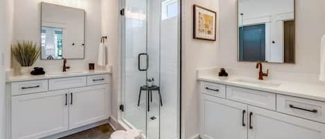 Bathtub, hair dryer, towels, shampoo