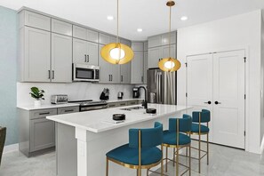 Fridge, microwave, oven, stovetop - Villa Bliss | Designer home with modern kitchen, grand LR/ DR, next to Universal (Orlando)