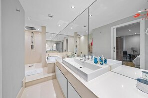 Separate bathtub and shower, deep-soaking bathtub, hair dryer, towels
