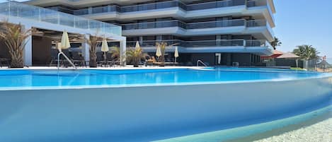 Outdoor pool, pool umbrellas, pool loungers