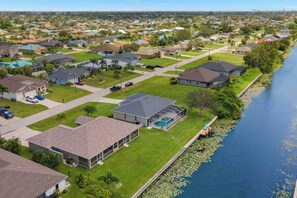 Exterior - Cape Coral Canalfront Oasis: Private Dock, Heated Pool & Arcade Fun (Cape Coral)