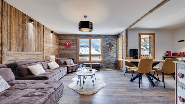 A modern living room with a sofa, a dining table with chairs, a fireplace, and a view of mountains through large windows. - Very nice apartment, 3 Bedrooms Very nice view (Val-d'Isère)