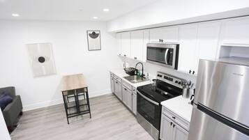 Coffee/tea maker, fridge, microwave, oven