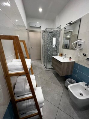 Shower, eco-friendly toiletries, hair dryer, bidet