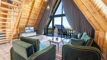 Grand Bungalow | Living area | 110-cm Smart TV with digital channels, Netflix, streaming services