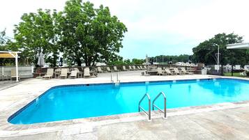 Seasonal outdoor pool, open 10:00 AM to 8:00 PM, pool umbrellas