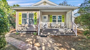 A single-story house with a front porch, a small deck, and a mailbox. - Family Friendly | Walk to Beach & Dining | Firepit (Santa Rosa Beach)