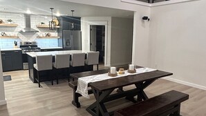 A modern kitchen with a dining area. - The Great Plains Escape (Enid)