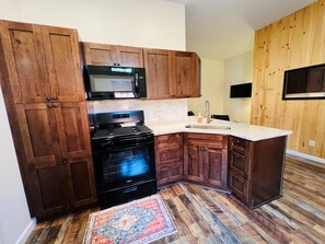 Fridge, microwave, oven, stovetop - Lil E's Pad #1 -The ultimate Adirondack apartment for two.   (Old Forge)