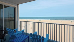 A balcony with a view of the beach and ocean. - 🏖️ Luxury Oceanfront Retreat • Steps to Boardwalk • Rooftop Pool + Parking 🏖️ (Ocean City)