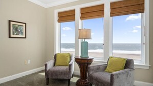 A room with two armchairs, a table, and a view of the beach. - 🏖️ Luxury Oceanfront Retreat • Steps to Boardwalk • Rooftop Pool + Parking 🏖️ (Ocean City)