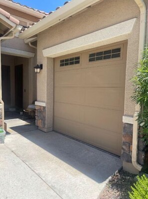 Guests can access the garage with a convenient entrance and a small window for natural ventilation.