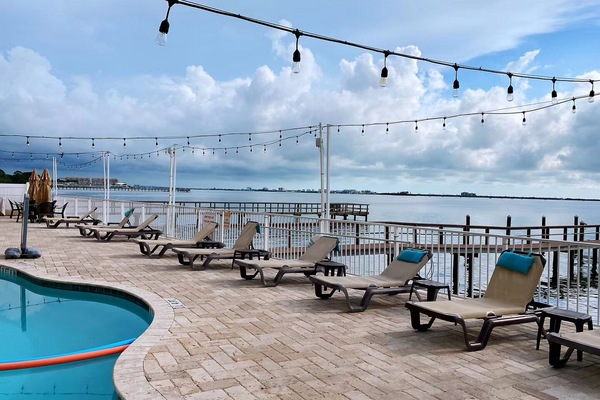 Heated swimming pool, lounge chairs, boat docks, fishing pier with gulf view.