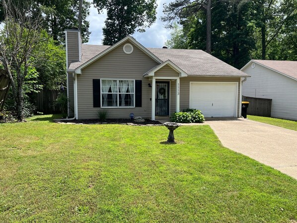 A residential house with a front yard, a driveway, and a garage. - CU at Copper Creek for a memorable 5 star experience.  (Benton)