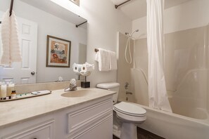 A bathroom with a sink, toilet, and bathtub. - CU at Copper Creek for a memorable 5 star experience.  (Benton)