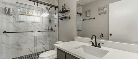 Shower, hair dryer, towels, soap
