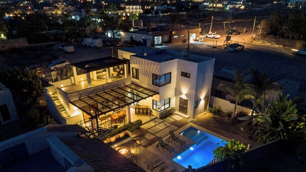 A modern house with a swimming pool, outdoor seating, and a covered patio area. - Casa Alas. Newly built, private pool, and a short walk to the beach! (Todos Santos)