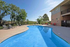 Outdoor pool, a heated pool - Top Floor, Modern Suite with Balcony Pool Views (West Des Moines)