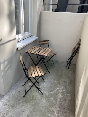 Enjoy a patio with a table and chairs, perfect for outdoor dining.