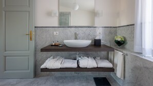 A bathroom with a white sink, marble countertop, and a towel rack. - Residence  Tulipe N3004 (Lucca)