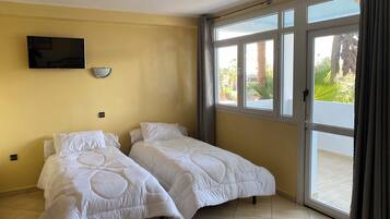 Economy Quadruple Room, City View | Free WiFi, bed sheets