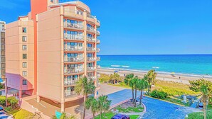 A multi-story hotel with balconies overlooking a beach. - Huge 25 foot circle balcony/MODERN COASTAL/Best view in Myrtle Beach (Myrtle Beach)