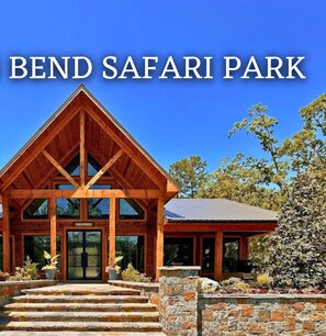 A lodge with a wooden facade and a stone entrance, labeled "Beavers Bend Safari Park."