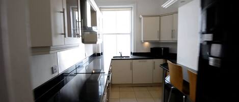 Apartment, Multiple Beds | Private kitchen