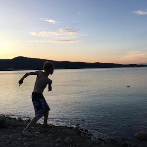 Guests can enjoy serene lakeside views from the shore.