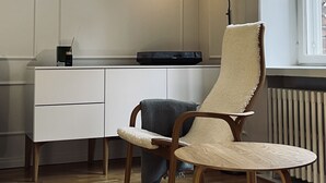A modern office space with a desk, chair, and pendant light. - High-end, quiet, downtown home (Helsinki)