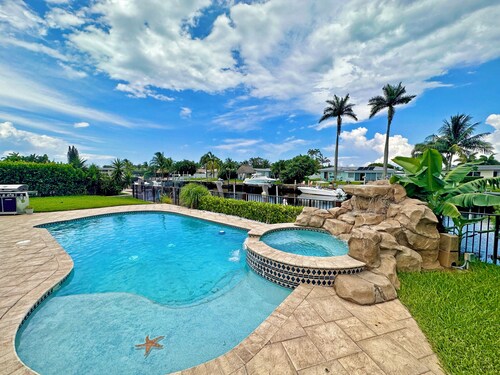 Waterfront home with private backyard. Heated pool with waterfall Jacuzzi 